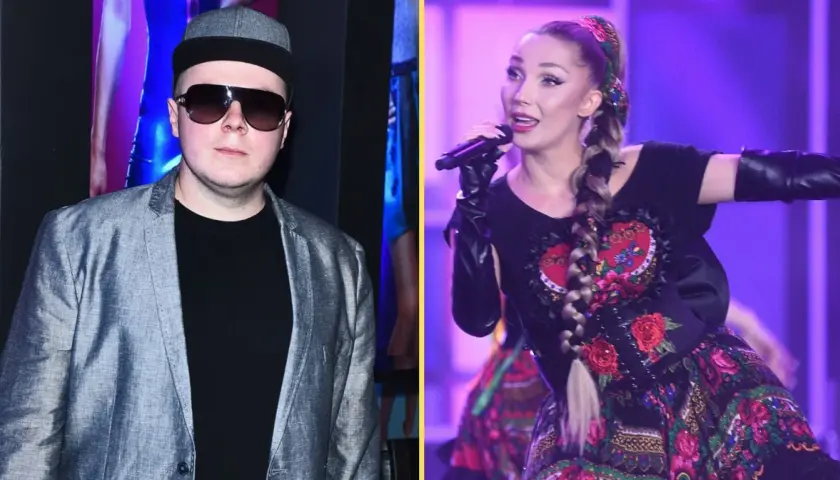 Donatan i Cleo na scenie. Donatan w szarej marynarce i czapce, Cleo w tradycyjnej sukni z haftem.